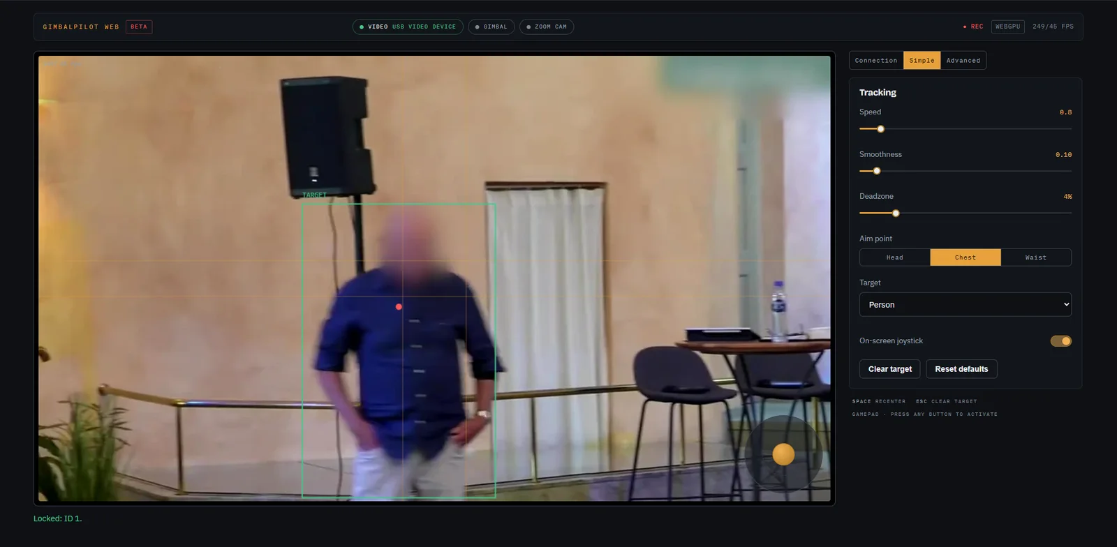 GimbalPilot Web in a browser tab tracking a speaker: the camera feed with a lock-on box around him, an on-screen joystick and zoom rocker on the monitor, and the Connection, Simple and Advanced tabs in the console beside it